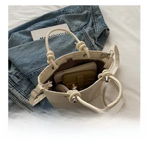 Top view of white crossbody bag interior showing spacious capacity for phone and wallet