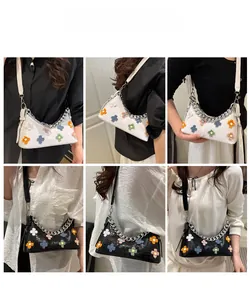 Chic baguette bags with 3D floral accents and chain straps in black and white styles