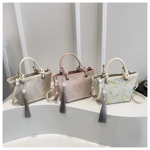 Three elegant vintage Chinese style jacquard handbags with tassels and embroidery patterns
