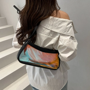 Detailed holographic PVC texture on large black shoulder bag with laser reflection
