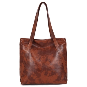 Vintage brown leather tote bag with distressed texture and double shoulder straps