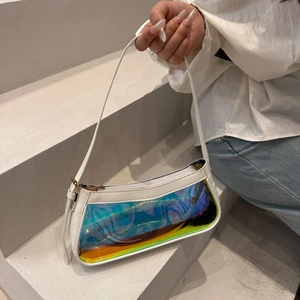 Detailed shot of the holographic PVC panel and white PU strap on the crescent underarm bag