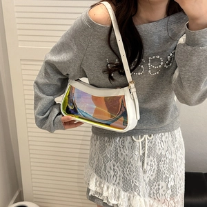 Close-up of white leather edge and iridescent laser PVC panel on the shoulder bag