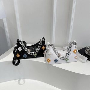 Floral baguette hobo bag with embossed crocodile texture and colorful plush flower accents