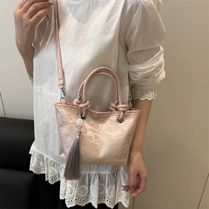 Vintage Chinese style apricot embroidery bucket bag with landscape pattern and tassel charm