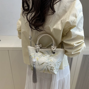 Elegant Chinese style bucket bag with gold leaf embroidery and tassel accessory