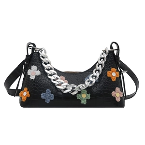 Black crocodile embossed baguette bag with colorful plush flowers and chunky silver chain