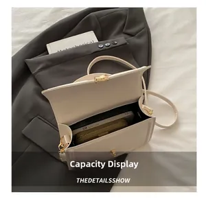 Interior view of cream white crossbody bag showing capacity for phone and wallet