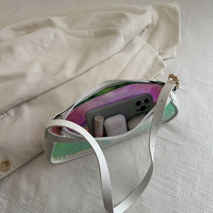 Chic white holographic transparent shoulder bag showing capacity for phone and lipstick