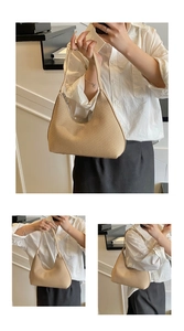 Macro view of beige woven texture and metal zipper detail on this hobo shoulder bag