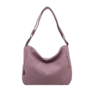 Minimalist solid color nylon crossbody bag with adjustable strap in dusty rose pink