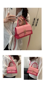 Detail of rose pink textured crossbody bag featuring gold horseshoe metal twist lock