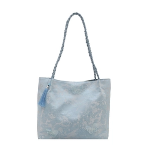 Light blue butterfly embroidery tote bag with chic tassel detail and woven handles