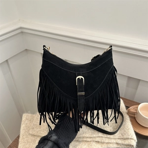 Minimalist black faux suede crossbody bag with long tassels and gold buckle detail