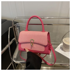 Pink PU leather and woven fabric crossbody bag with gold U-shaped metal lock clasp