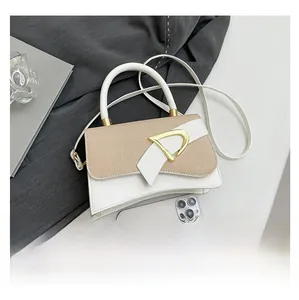 Size comparison of white textured crossbody bag with gold buckle and smartphone