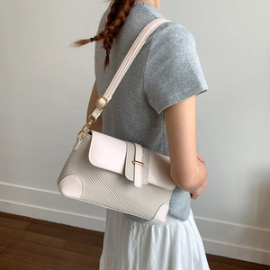 Chic beige woven leather crossbody bag with gold hardware and adjustable strap for women