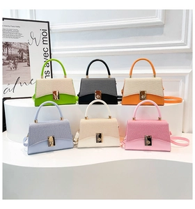 Multiple views of mini square bags in six vibrant colors with canvas and leather textures
