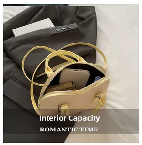 Interior view showing capacity of woven shell bag with phone and wallet inside