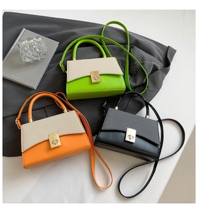 Three multi-color crossbody bags in green, orange, and black with mixed leather textures