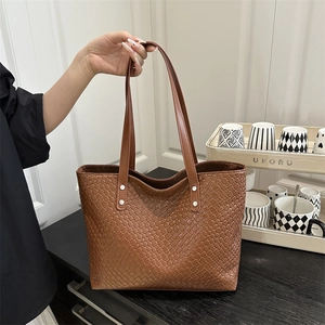 Brown woven tote bag with large capacity and dual slim shoulder straps for women