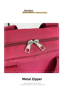Detail of premium red nylon fabric featuring durable dual metal zipper closures