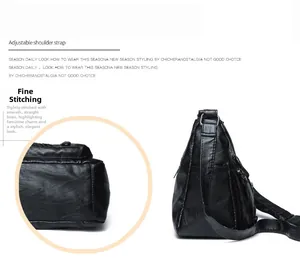 Close-up of adjustable shoulder strap and fine stitching on the black leather bag