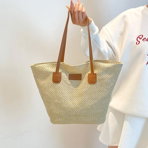 Sac seau en paille beige avec poignées en cuir et patch Fashion pour l'été