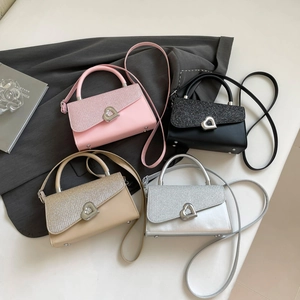 Glittery square handbags in four colors with metallic heart clasps and shoulder straps