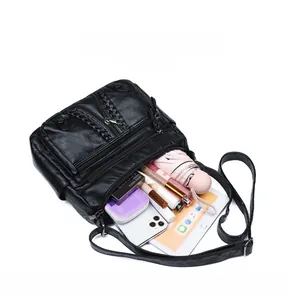 Detailed top view of large capacity crossbody bag showing organized interior storage compartments