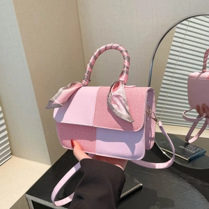 Elegant pink patchwork tote bag with woven texture, scarf handle and long shoulder strap