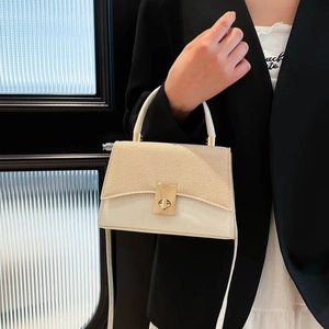 Contrast panel cream leather and woven texture crossbody handbag with gold twist lock