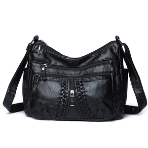 Black vintage soft leather shoulder bag with multiple zippers and woven details
