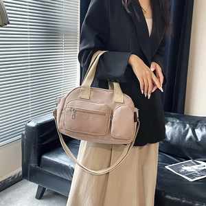 Large beige nylon tote bag with multiple pockets and adjustable strap for women travel