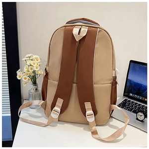 Ergonomic back view of a color-block backpack with padded shoulder straps and side pocket