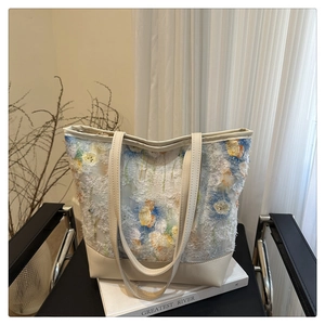 Detailed view of floral chiffon texture with 3D embossed embroidery on tote bag