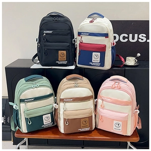 Detailed view of large-capacity multi-pocket nylon backpacks in five assorted colorways