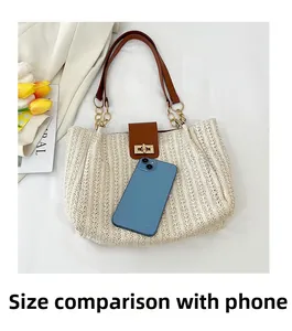 Size comparison of a straw tote bag with a smartphone showing dimensions and leather strap