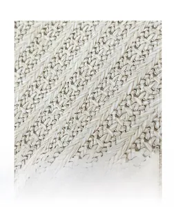 Macro detail of the premium straw woven texture on a high-quality summer beach tote bag