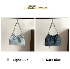 Detail of light and dark blue denim bucket bags with shimmering fabric and beaded handles