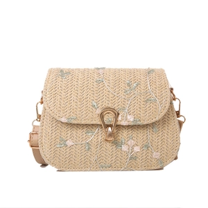 Fashionable straw crossbody bag for women with floral embroidery and gold snap closure
