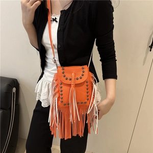 Vintage orange crossbody bag with fringes and metal studs in lychee leather style