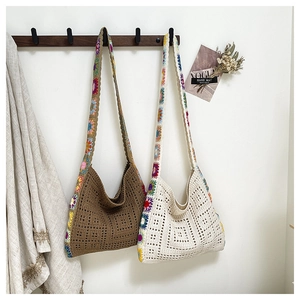 Detail of bohemian knit bags with granny square straps in brown and beige colors