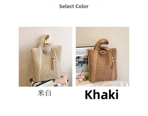 Detail view of woven straw tote bags in cream and khaki with tassel and wooden beads