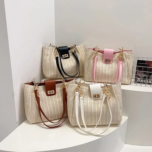 Stylish straw woven tote bags in four colors with faux leather trim and gold twist locks