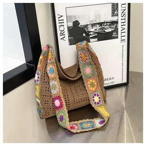 Detail of bohemian knit tote bag showing handmade crochet textures and floral patterns