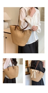Detail of woven straw tote bag with brown leather handles and white lace bow decor