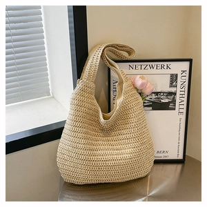 Detailed close-up of woven straw tote bag texture and soft interior fabric lining
