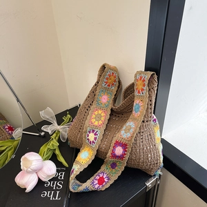 Bohemian crochet tote bag with brown hollow knit and colorful sunflower strap detail