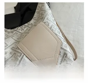 Detail of vintage geometric jacquard fabric and leather patch on Chinese style tote bag